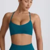 Sujetador deportivo sin costuras Super Sculpt con espalda cruzada en color verde azulado