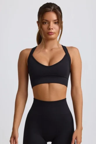 Sujetador deportivo sin costuras Super Sculpt con espalda cruzada en negro