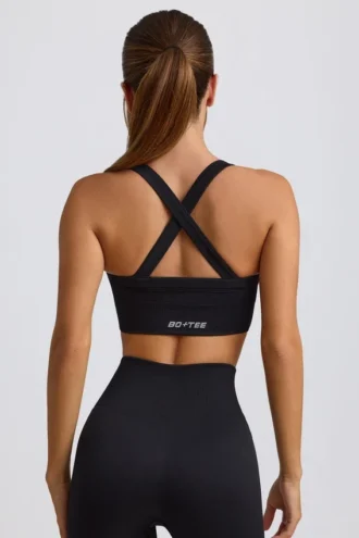 Sujetador deportivo sin costuras Super Sculpt con espalda cruzada en negro