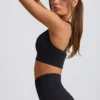 Sujetador deportivo sin costuras Super Sculpt con espalda cruzada en negro