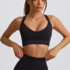 Sujetador deportivo sin costuras Super Sculpt con espalda cruzada en negro