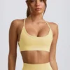 Sujetador deportivo sin costuras y sin espalda Super Sculpt en amarillo mantequilla