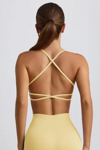 Sujetador deportivo sin costuras y sin espalda Super Sculpt en amarillo mantequilla