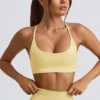 Sujetador deportivo sin costuras y sin espalda Super Sculpt en amarillo mantequilla