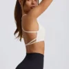 Sujetador deportivo sin costuras y sin espalda Super Sculpt en blanco