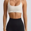 Sujetador deportivo sin costuras y sin espalda Super Sculpt en blanco