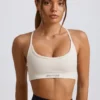 Sujetador deportivo sin costuras y sin espalda Super Sculpt en blanco