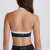 Sujetador deportivo Soft Active con cuello halter y detalle retorcido en la parte delantera en negro