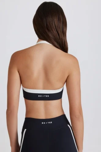 Sujetador deportivo Soft Active con cuello halter y detalle retorcido en la parte delantera en negro