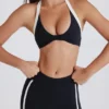 Sujetador deportivo Soft Active con cuello halter y detalle retorcido en la parte delantera en negro
