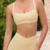 Sujetador deportivo Soft Active con detalles de costuras en color limón