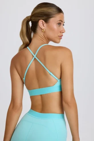Sujetador deportivo Soft Active con espalda cruzada en color aguamarina