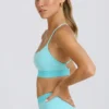 Sujetador deportivo Soft Active con espalda cruzada en color aguamarina