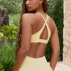 Sujetador deportivo Soft Active con tirantes cruzados en la espalda en color limón