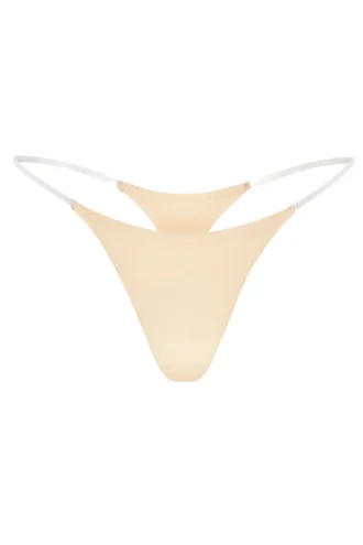 Tanga de punto sin costuras con tirantes transparentes en melocotón cálido