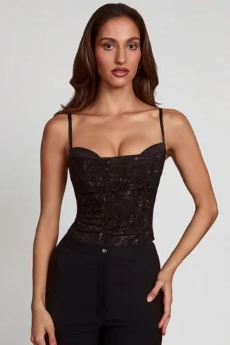 Top Armelia con cuello vuelto y adornos Peekaboo en negro