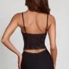 Top Armelia con cuello vuelto y adornos Peekaboo en negro