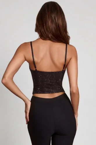 Top Armelia con cuello vuelto y adornos Peekaboo en negro