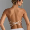 Top bandeau con tirantes cruzados en la espalda y adornos Nanaka en blanco
