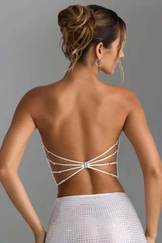 Top bandeau con tirantes cruzados en la espalda y adornos Nanaka en blanco
