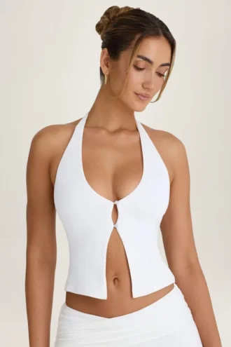 Top con cuello halter y abertura frontal de Covia en blanco