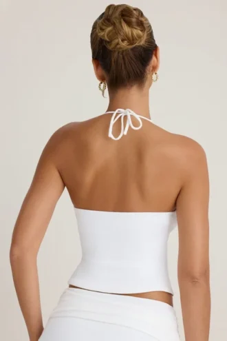 Top con cuello halter y abertura frontal de Covia en blanco