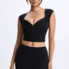 Top Cora de modal con fruncidos y mangas casquillo en negro