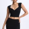 Top Cora de modal con fruncidos y mangas casquillo en negro