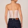 Top corsé bandeau con cordones Zoa en color marfil
