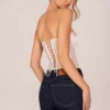 Top corsé bandeau con cordones Zoa en color marfil