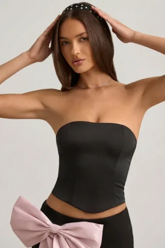 Top corsé con aberturas y lazo Audrina en negro
