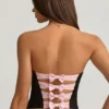 Top corsé con aberturas y lazo Audrina en negro