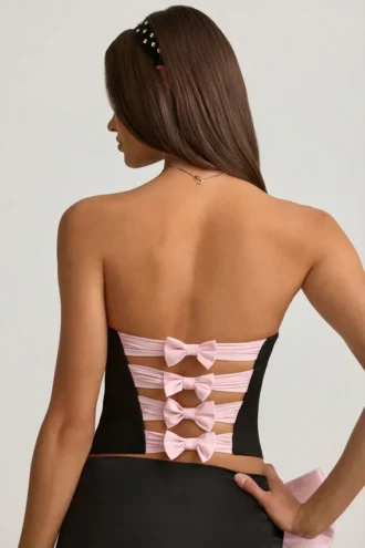 Top corsé con aberturas y lazo Audrina en negro