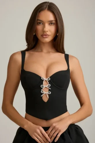 Top corsé con aberturas y lazo Pearla en negro