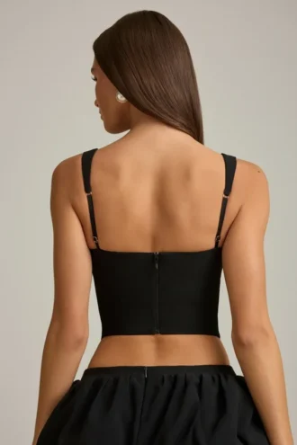 Top corsé con aberturas y lazo Pearla en negro