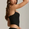 Top corsé con aberturas y lazo Pearla en negro