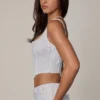 Top corsé con cordones y adornos Letitia en blanco