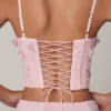 Top corsé con cordones y adornos Letitia en rosa suave