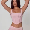 Top corsé con cordones y adornos Letitia en rosa suave