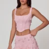 Top corsé con cordones y adornos Letitia en rosa suave