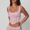 Top corsé con cordones y adornos Letitia en rosa suave