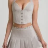 Top corsé con cuello halter Lotta en color crudo