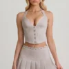 Top corsé con cuello halter Lotta en color crudo