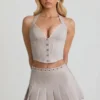 Top corsé con cuello halter Lotta en color crudo