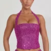 Top corsé con cuello halter y adornos Caralie en magenta