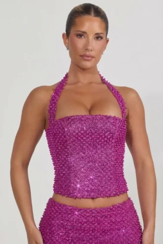 Top corsé con cuello halter y adornos Caralie en magenta