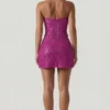Top corsé con cuello halter y adornos Caralie en magenta