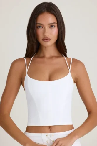 Top corsé con tirantes y cuello halter Elba en blanco