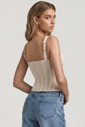 Top corsé de encaje con aros Junia en color marfil