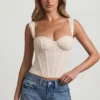 Top corsé de encaje con aros Junia en color marfil
